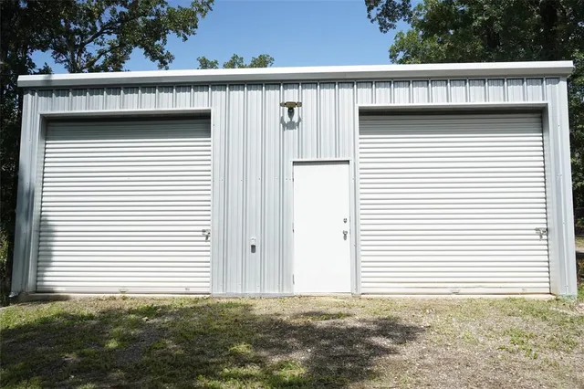 a view of a house with a small yard