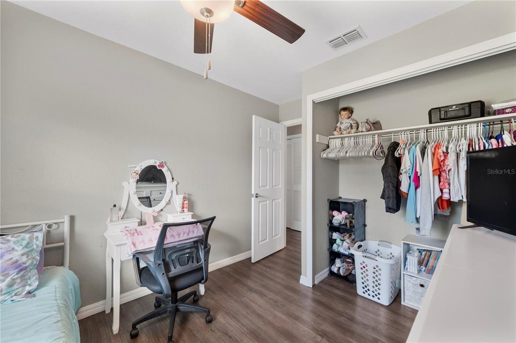 6830 County Line Road Lakeland, FL 33811 - Photo 19 of 32 a view of a workspace with furniture and wooden floor