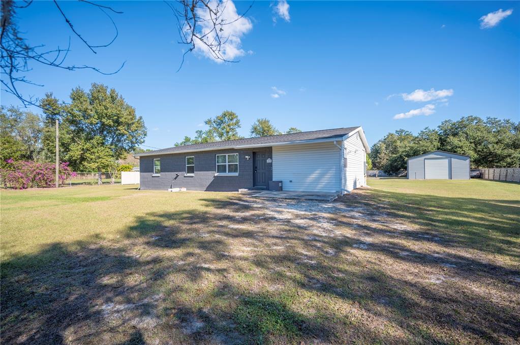 6830 County Line Road Lakeland, FL 33811 - Photo 3 of 32 a view of a house with a outdoor space