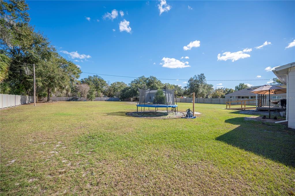 6830 County Line Road Lakeland, FL 33811 - Photo 5 of 32 a house view with swimming pool and garden space