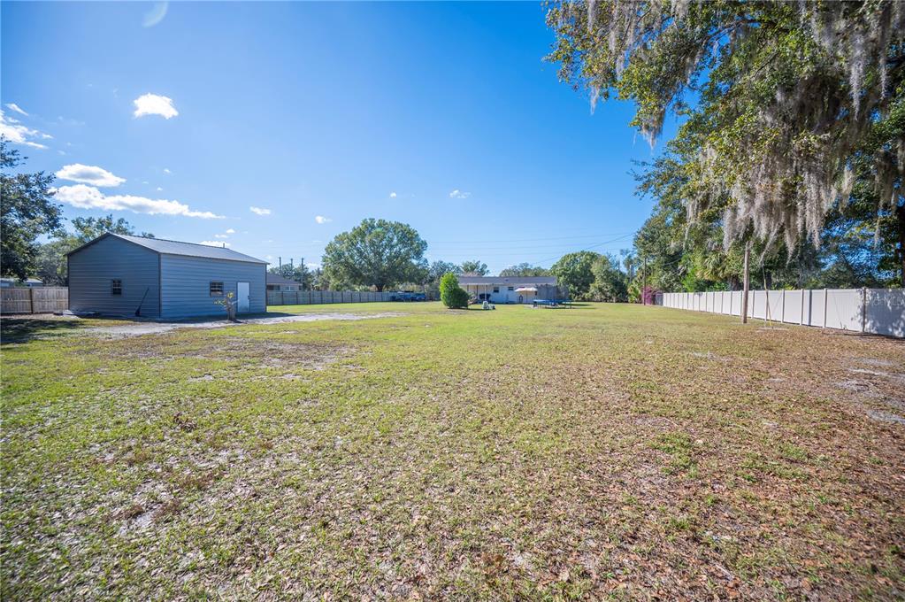 6830 County Line Road Lakeland, FL 33811 - Photo 8 of 32 a view of a patio with a yard