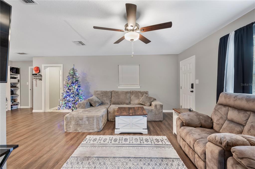 6830 County Line Road Lakeland, FL 33811 - Photo 10 of 32 a living room with furniture and a rug