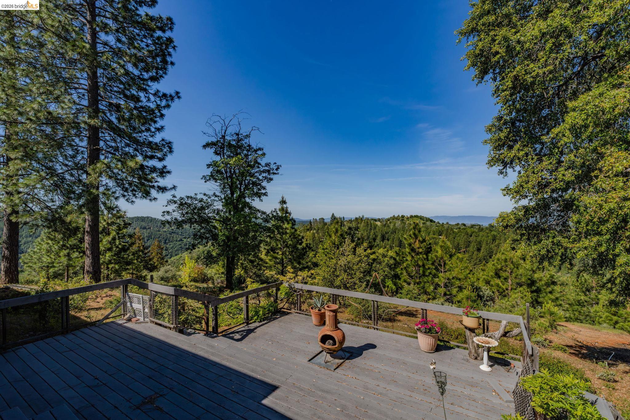 6161 Fullen Road Murphys, CA 95247 - Photo 13 of 53 a view of a roof deck with chair and wooden floor