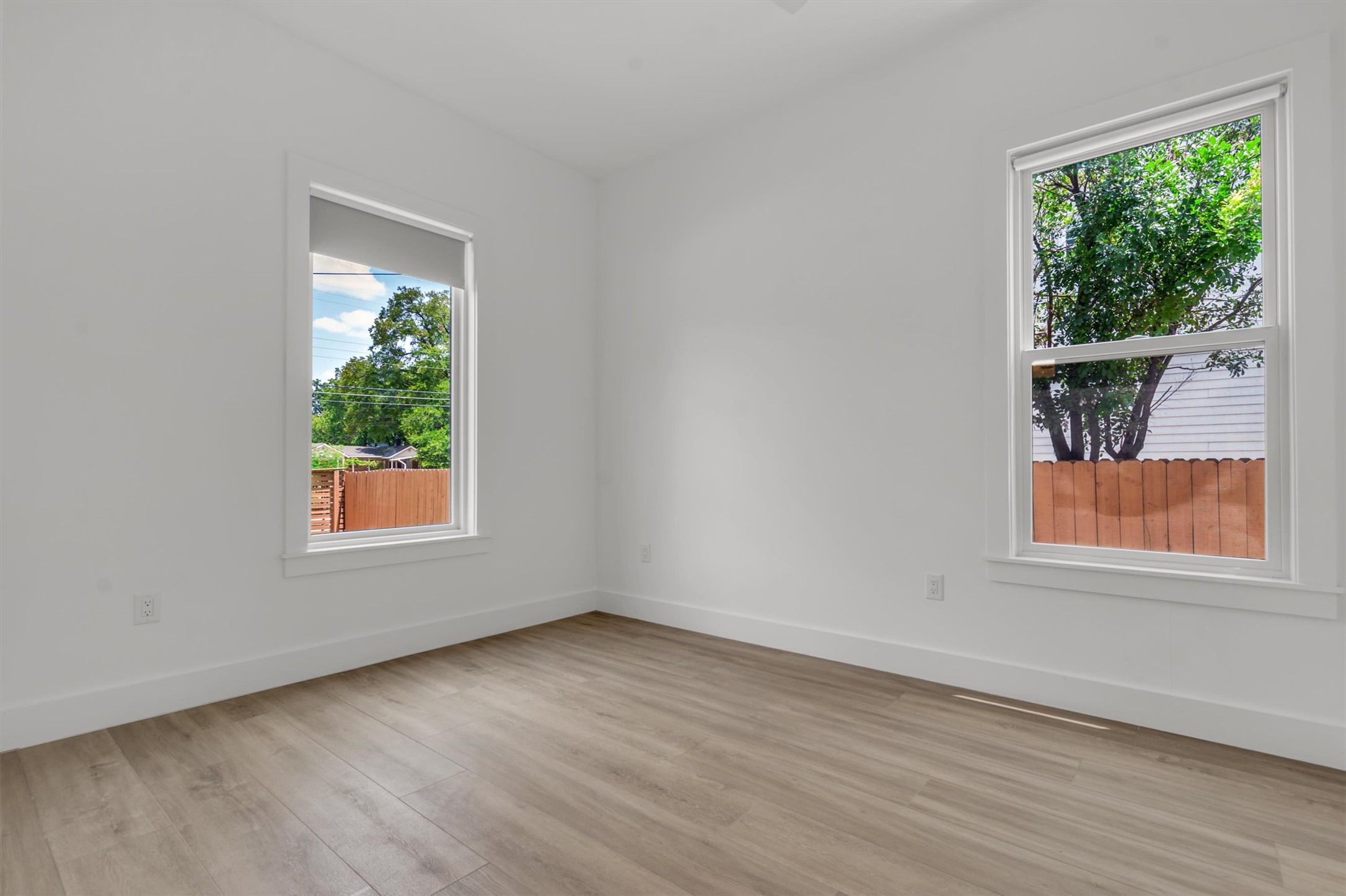 3101 Lyons Road Austin, TX 78702 - Photo 20 of 40 Clean lines and light-toned flooring create a serene and airy living space, ready for personalization.