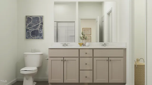 a bathroom with a sink toilet and mirror