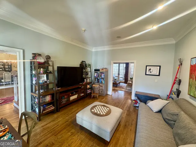 a living room with fireplace furniture and a flat screen tv