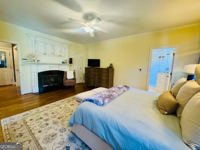 a spacious bathroom with a granite countertop sink and a mirror