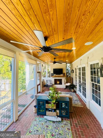 a living room with furniture a window and a fireplace