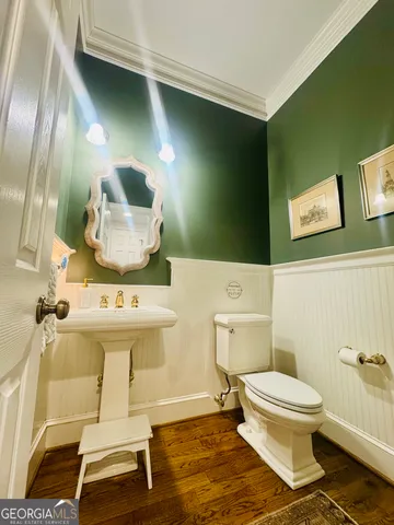 a view of a hallway with wooden shelves