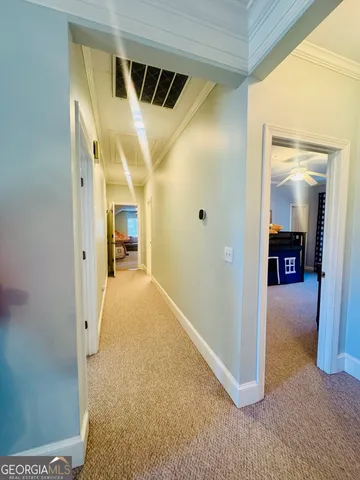 a bed room with a bed and a chandelier