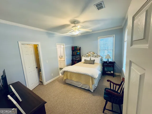 a spacious bathroom with a toilet sink and shower