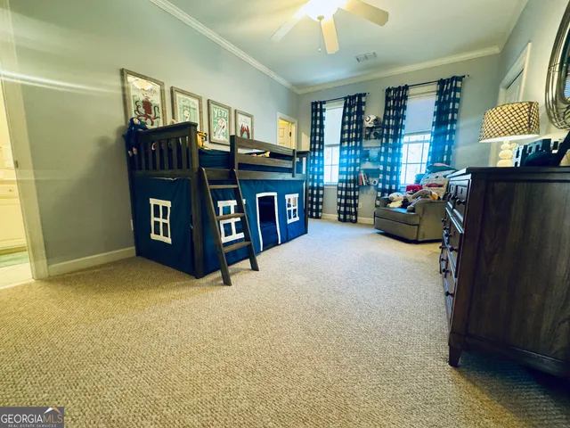 a bedroom with furniture and a chandelier