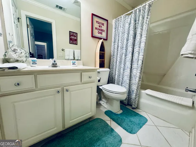 a bedroom with furniture and a chandelier