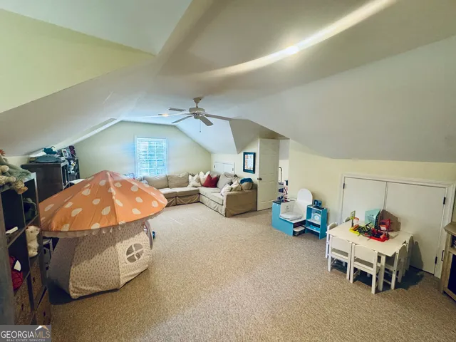 a view of a park with large trees