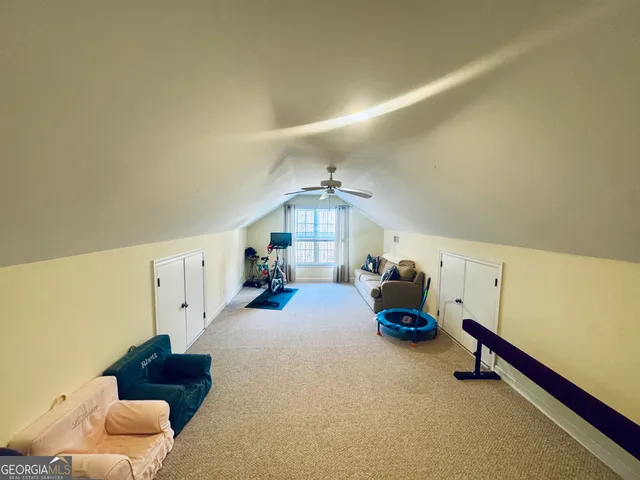 a view of a house with swimming pool and sitting area