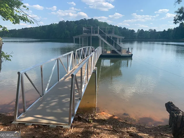 a view of a swimming pool with lounge chair