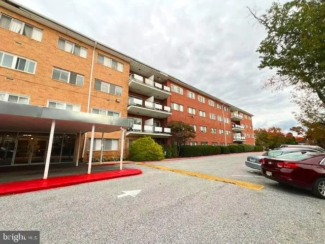 a view of an empty room with windows