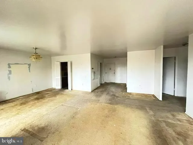 a kitchen with a refrigerator and a sink