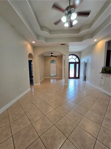 a view of a hallway with chandelier