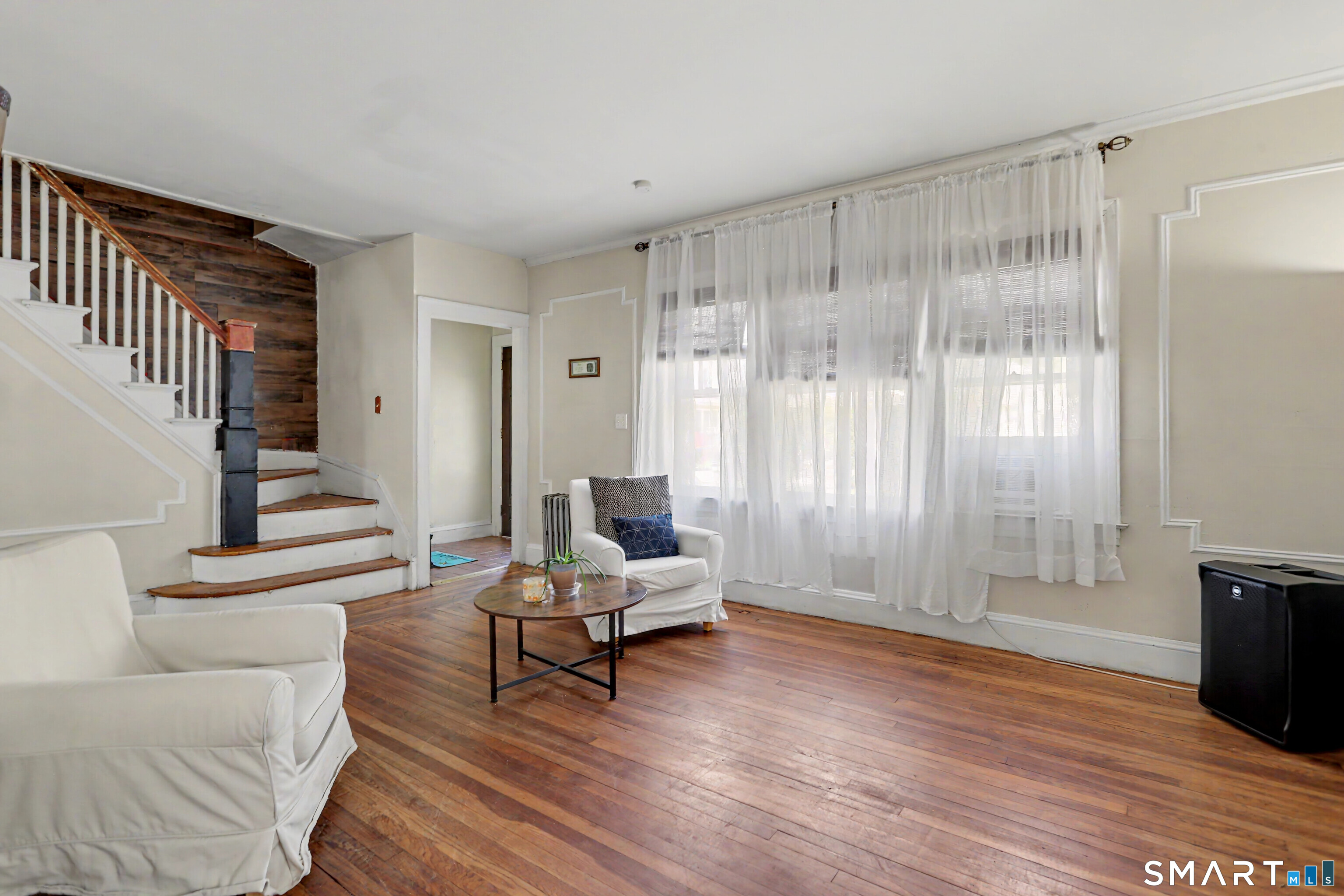 94 2nd Street Hamden, CT 06514 - Photo 6 of 31 a living room with furniture and a wooden floor
