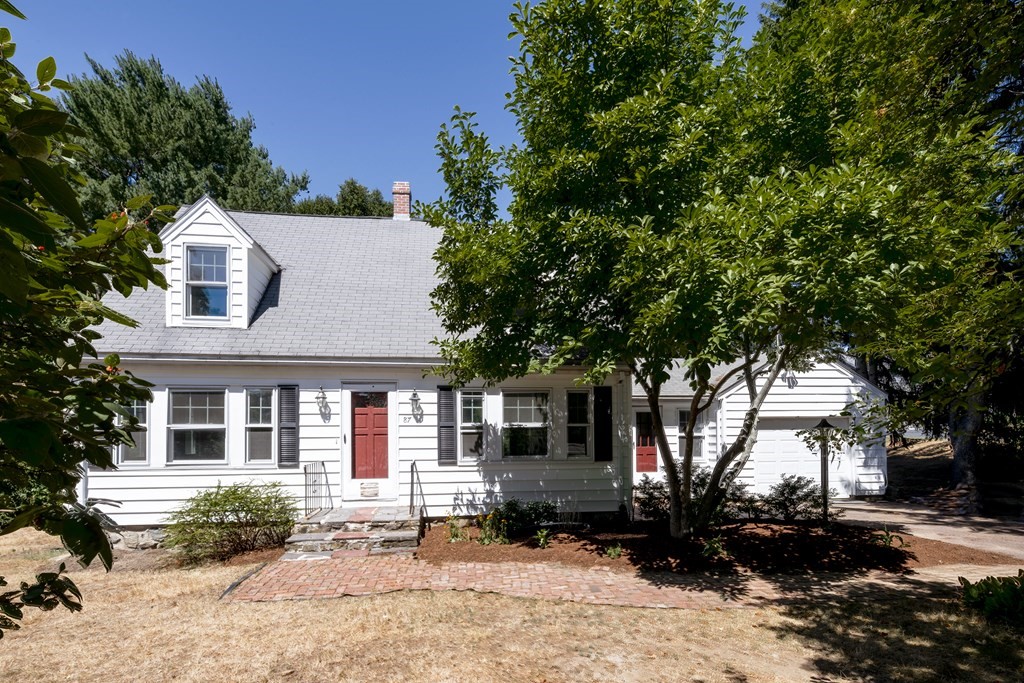 a front view of a house with a yard