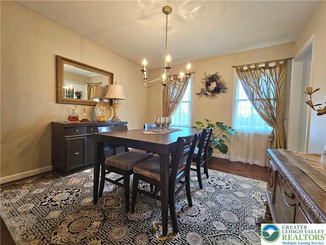 a bathroom with a sink mirror and toilet