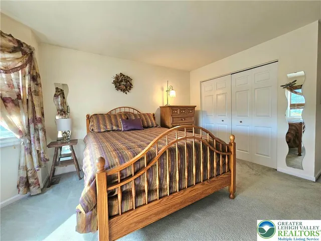 a bathroom with a sink a light fixture and a mirror