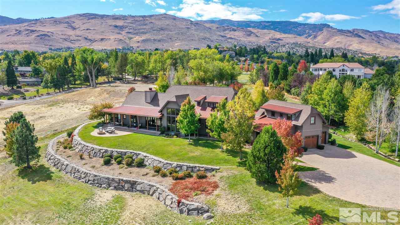 425 Juniper Hill Road Reno, NV 89519 - Photo 1 of 15 an aerial view of a house with a garden and lake view