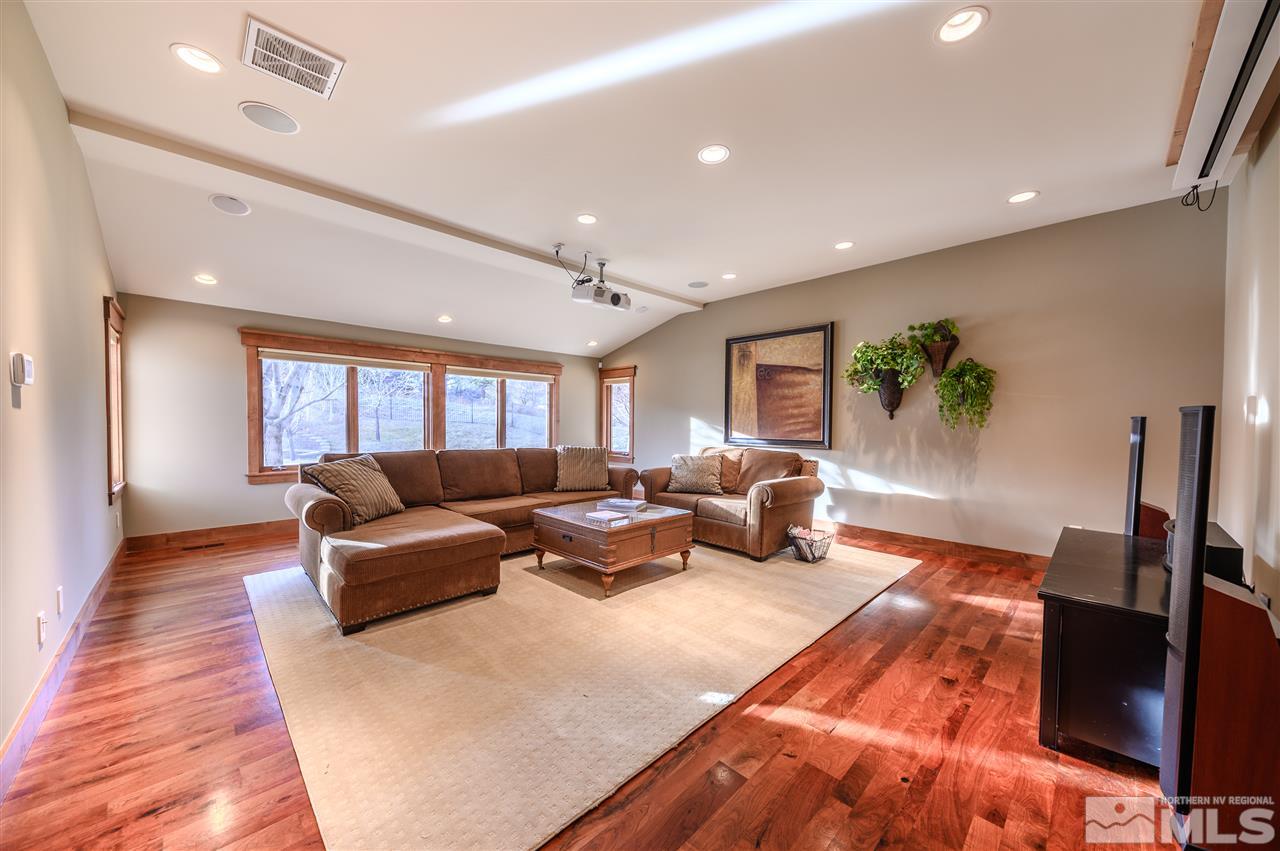 425 Juniper Hill Road Reno, NV 89519 - Photo 13 of 15 a living room with furniture and a flat screen tv