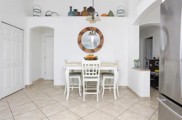 a view of a dining area with furniture and a clock