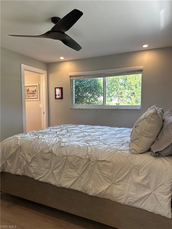 780 10th Avenue South, Unit 5 Naples, FL 34102 - Photo 12 of 27 a bedroom with a bed and a large window