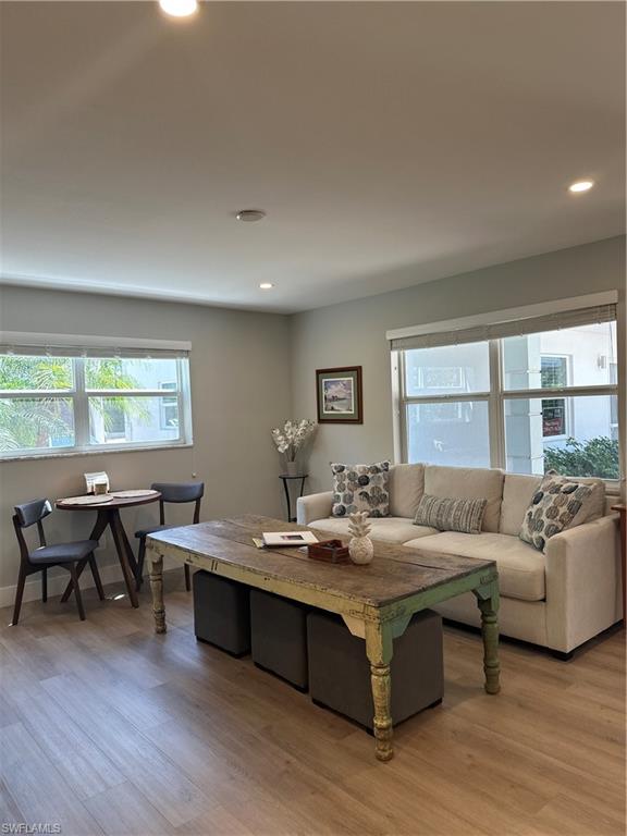 780 10th Avenue South, Unit 5 Naples, FL 34102 - Photo 5 of 27 a living room with furniture and wooden floor