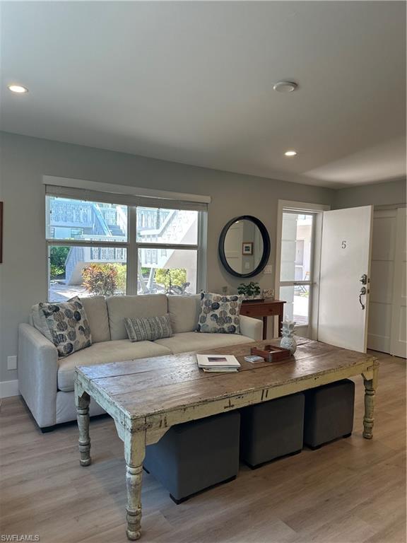 780 10th Avenue South, Unit 5 Naples, FL 34102 - Photo 7 of 27 a living room with stainless steel appliances granite countertop furniture and a large window