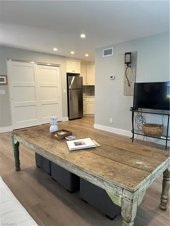 a room with pool table and flat screen tv