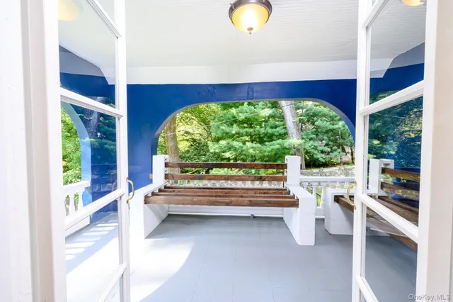 a view of room with window and furniture