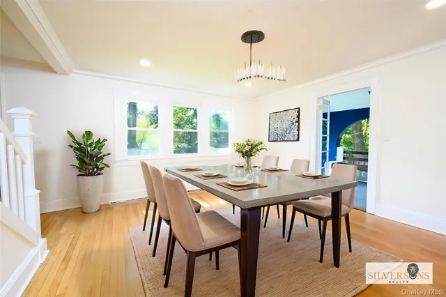 a view of a dining room with furniture window and wooden floor