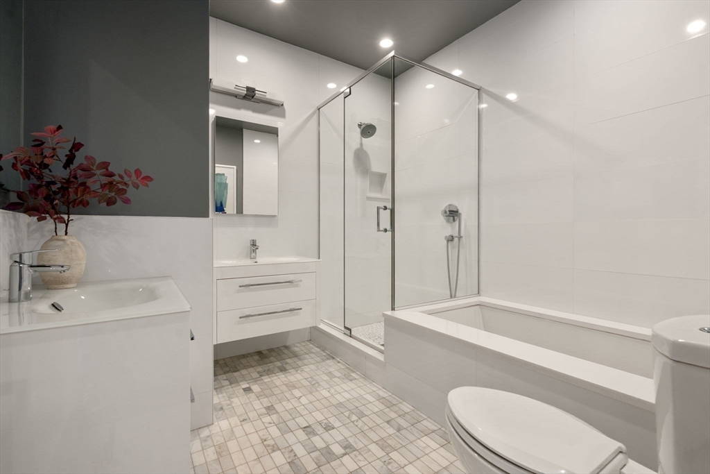 35 Hanson Street, Unit 2 Boston, MA 02118 - Photo 14 of 23 a bathroom with a sink a toilet and shower
