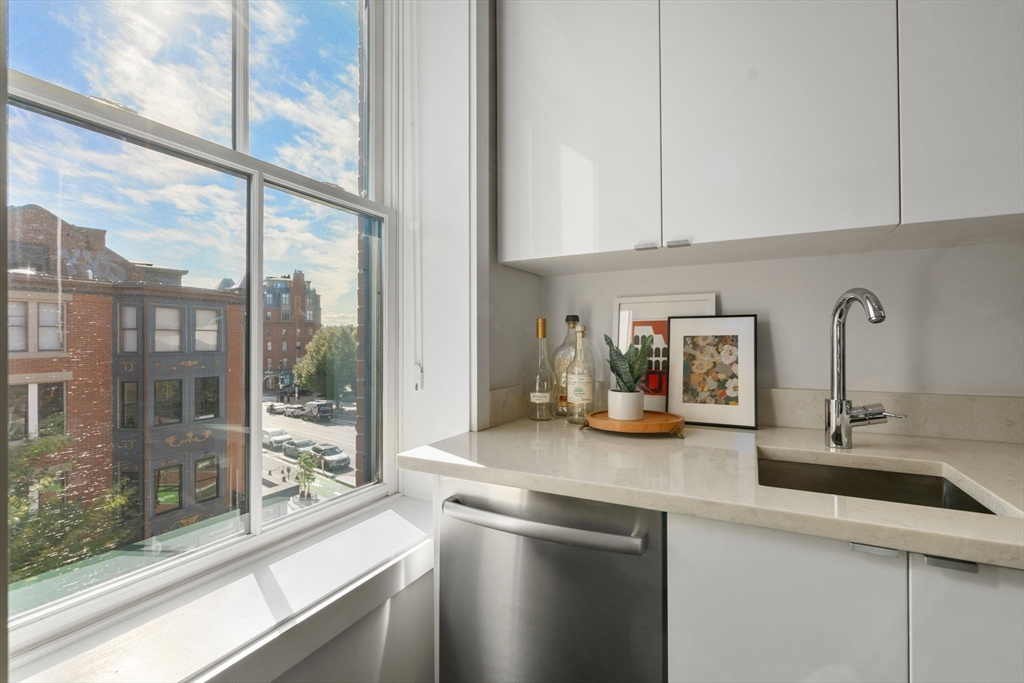 35 Hanson Street, Unit 2 Boston, MA 02118 - Photo 16 of 23 a kitchen with stainless steel appliances granite countertop a sink and a large window