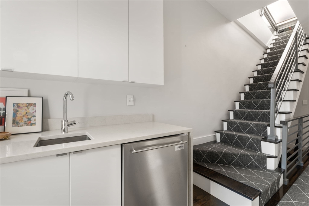 35 Hanson Street, Unit 2 Boston, MA 02118 - Photo 17 of 23 a kitchen with a refrigerator and a sink