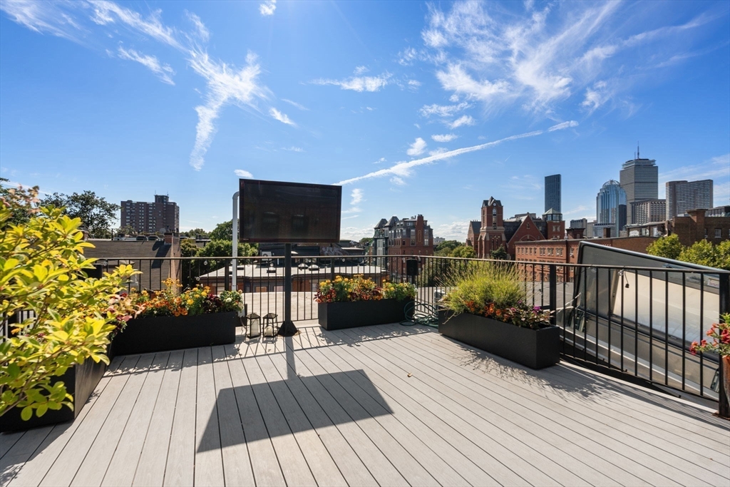 35 Hanson Street, Unit 2 Boston, MA 02118 - Photo 18 of 23 a view of a balcony with furniture and wooden floor