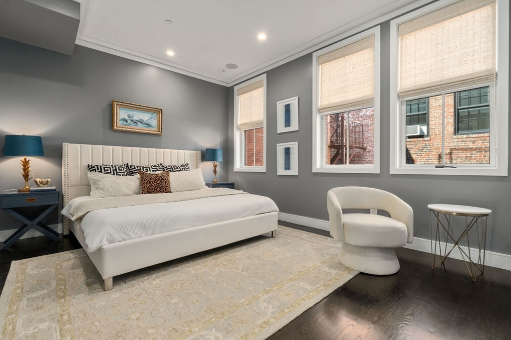 35 Hanson Street, Unit 2 Boston, MA 02118 - Photo 7 of 23 a bedroom with a bed and a large window