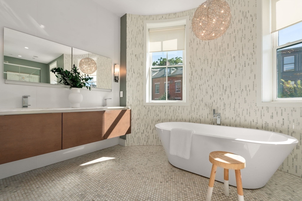 35 Hanson Street, Unit 2 Boston, MA 02118 - Photo 10 of 23 a bath tub sitting in a bathroom next to a window