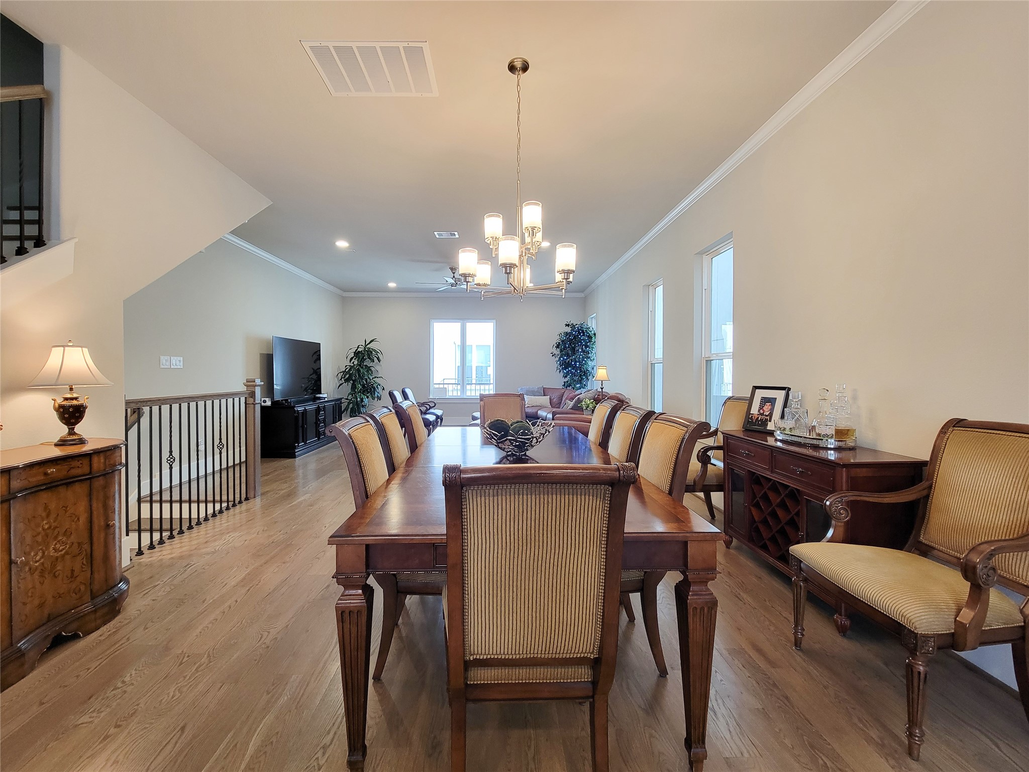 1315 West 24th Street, Unit A Houston, TX 77008 - Photo 33 of 33 Open floor plan with kitchen, dining and living. High ceilings, crown molding, neutral paint selection and wood flooring.