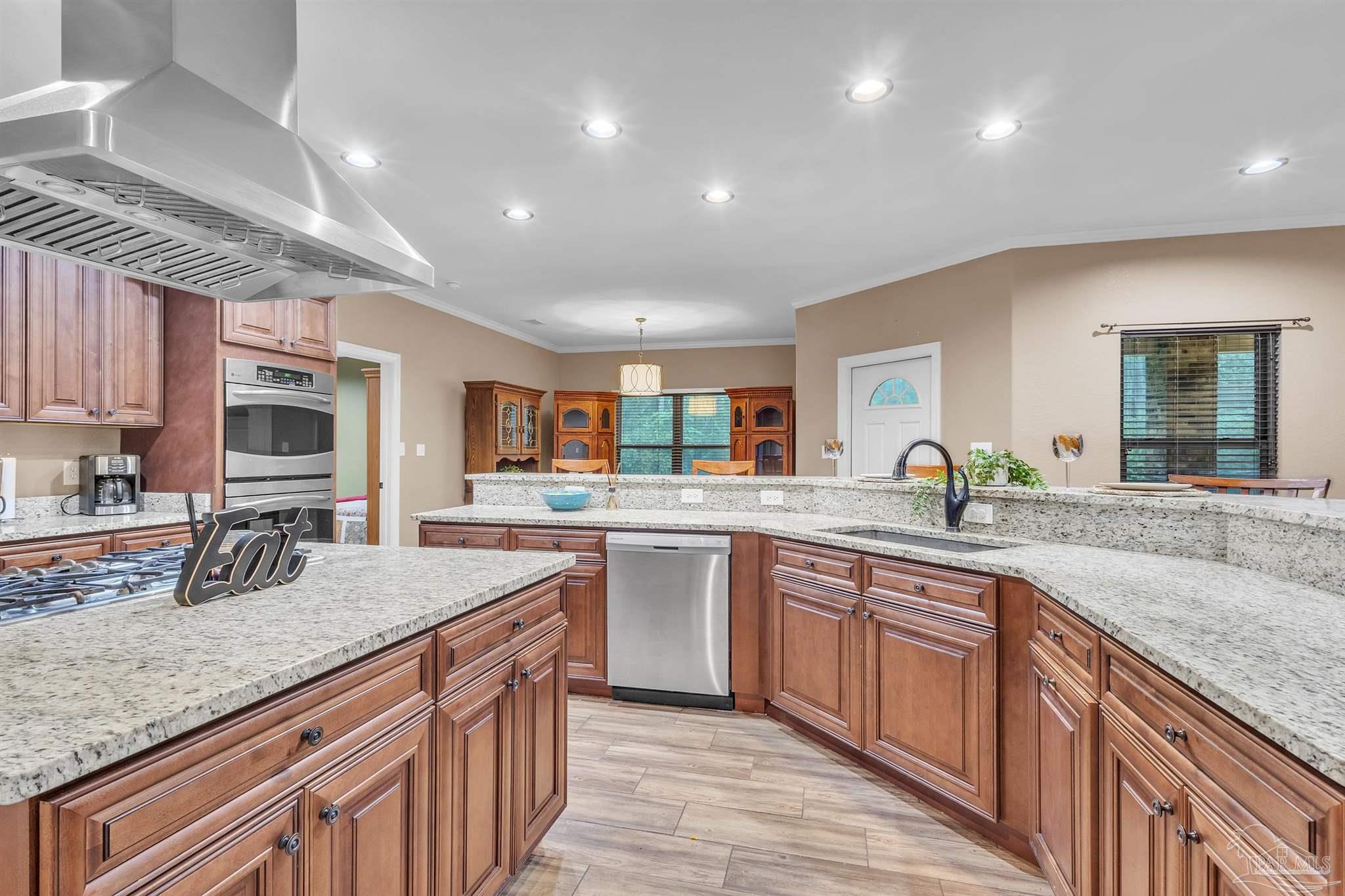 5406 Steele Road Baker, FL 32531 - Photo 15 of 46 a kitchen with lots of counter space and a sink