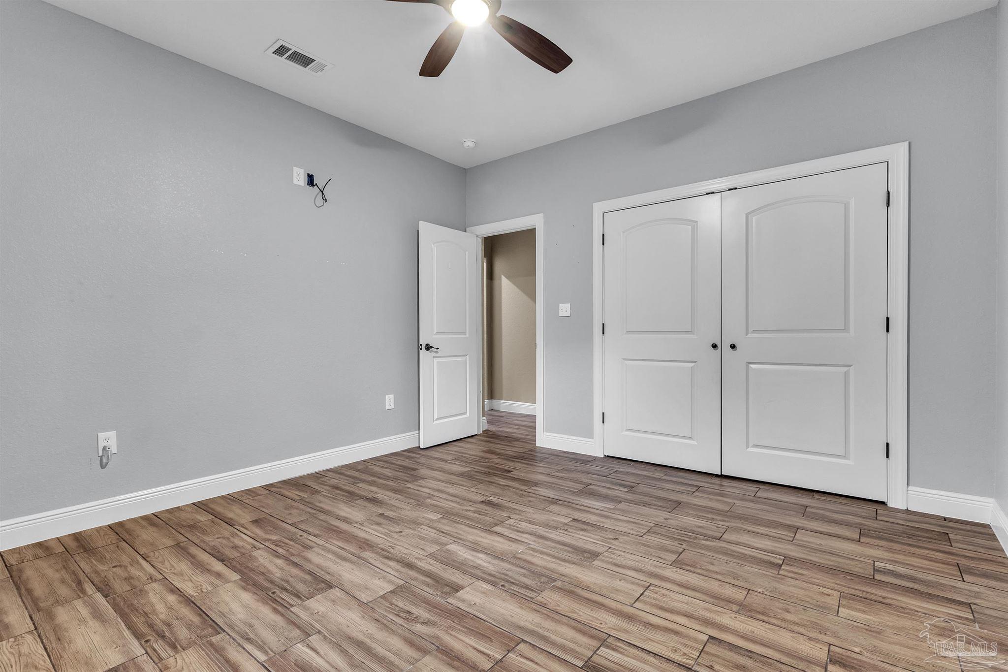 5406 Steele Road Baker, FL 32531 - Photo 27 of 46 wooden floor in an empty room