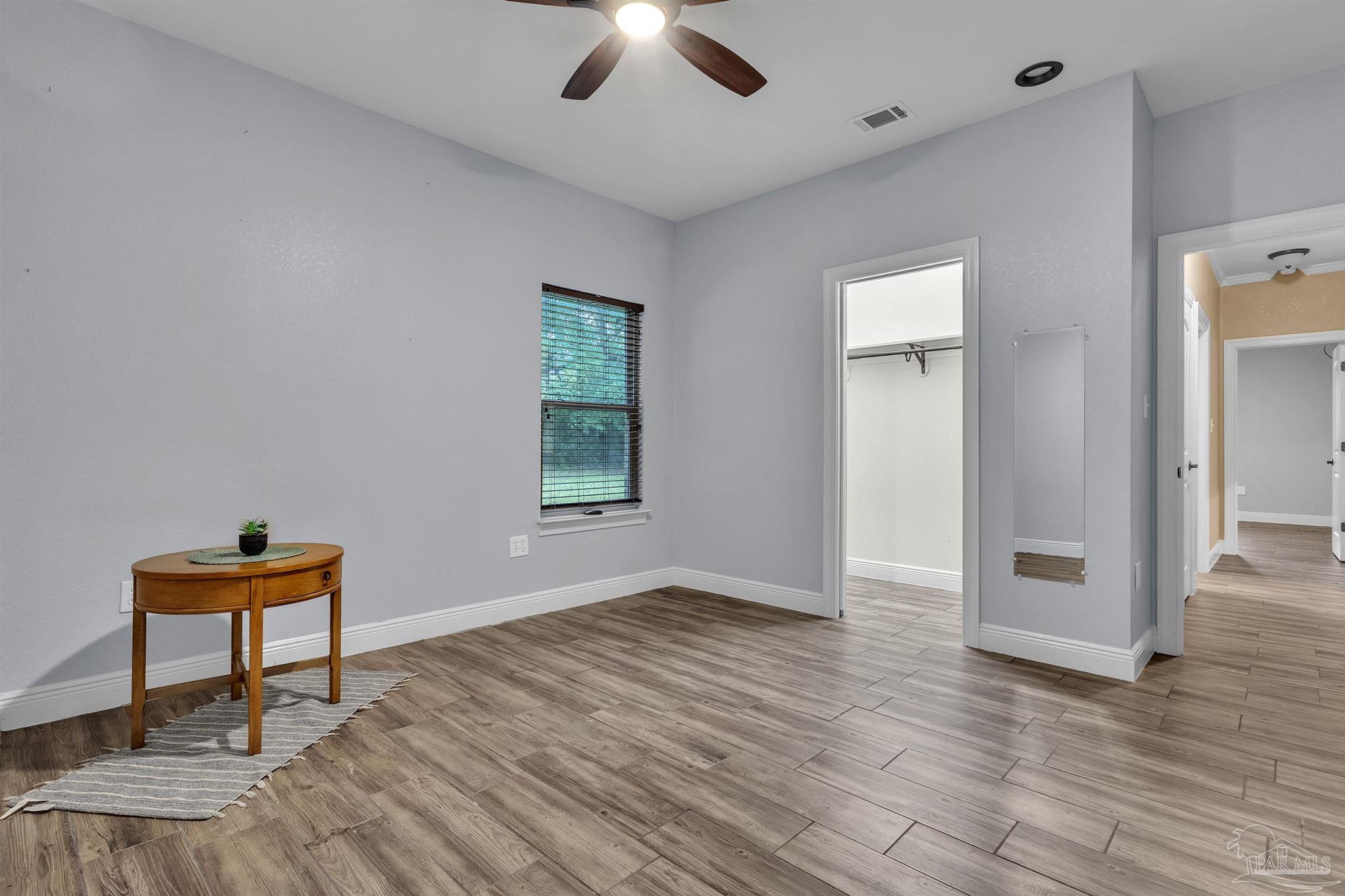 5406 Steele Road Baker, FL 32531 - Photo 30 of 46 wooden floor in an empty room with a window