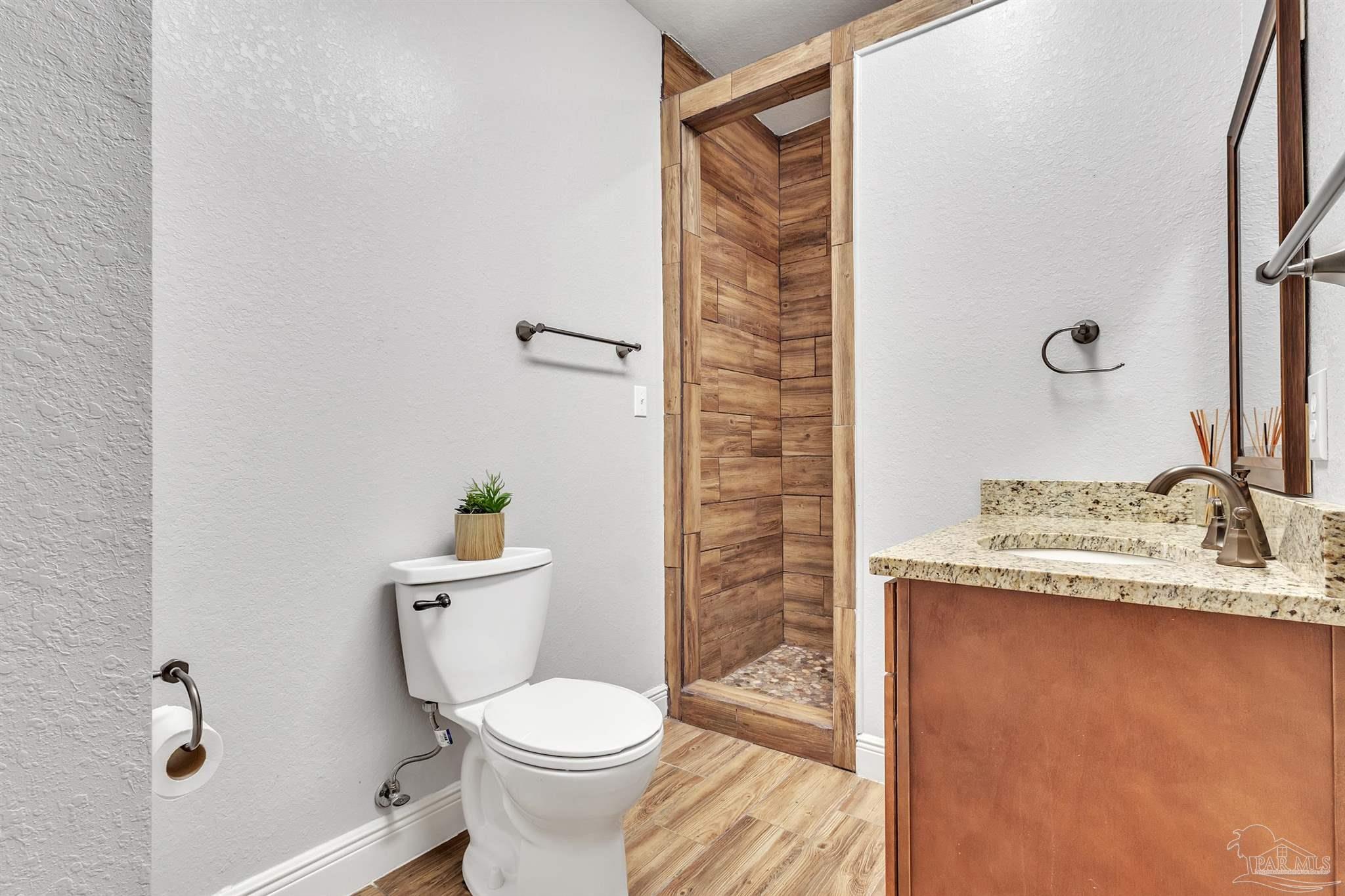 5406 Steele Road Baker, FL 32531 - Photo 33 of 46 a white toilet sitting next to a bathroom sink