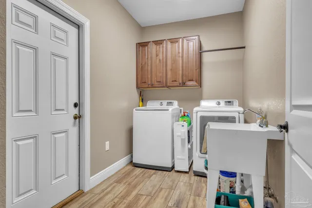 a view of a porch with chairs and backyard