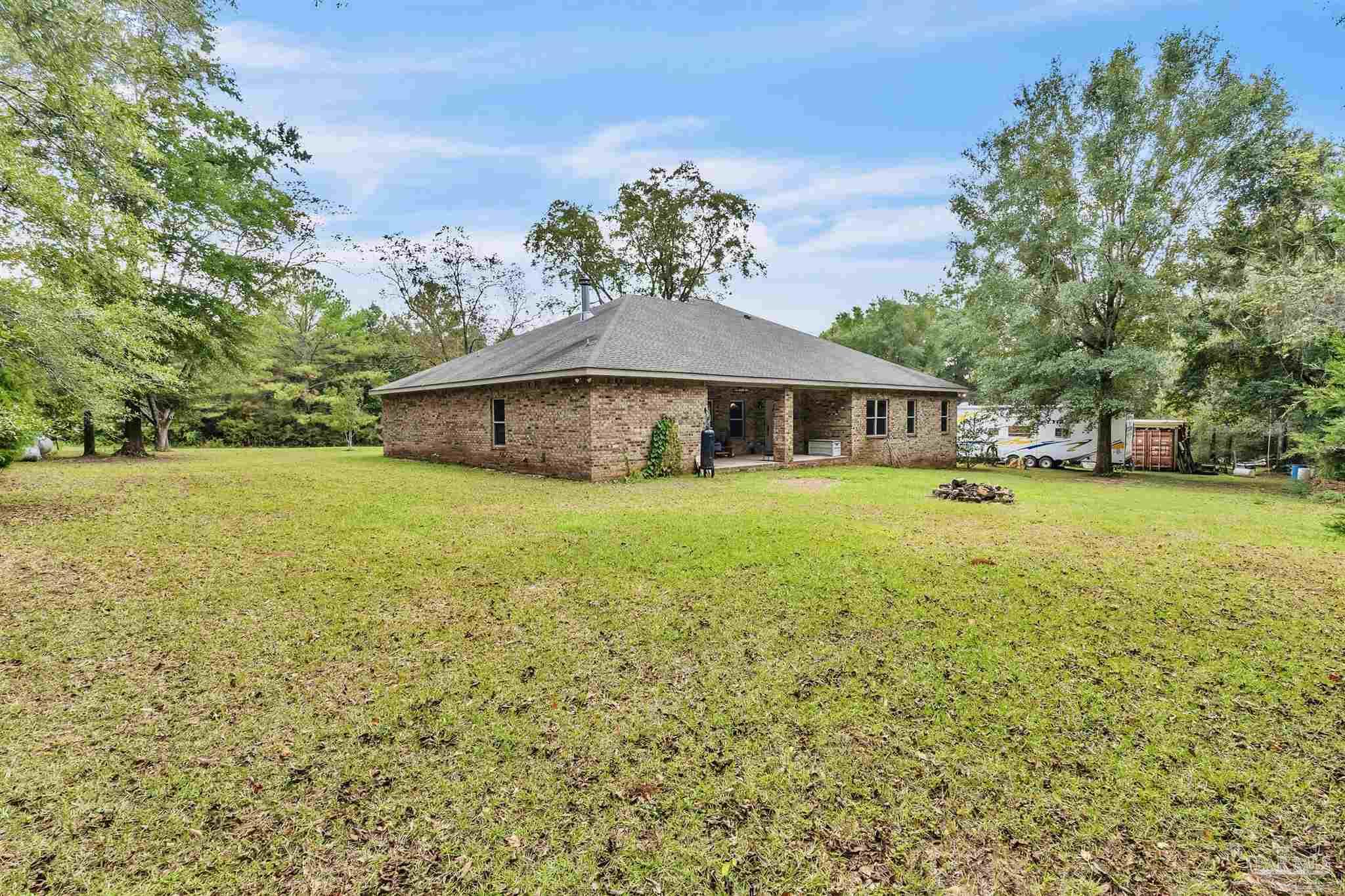 5406 Steele Road Baker, FL 32531 - Photo 38 of 46 a view of a house with a yard