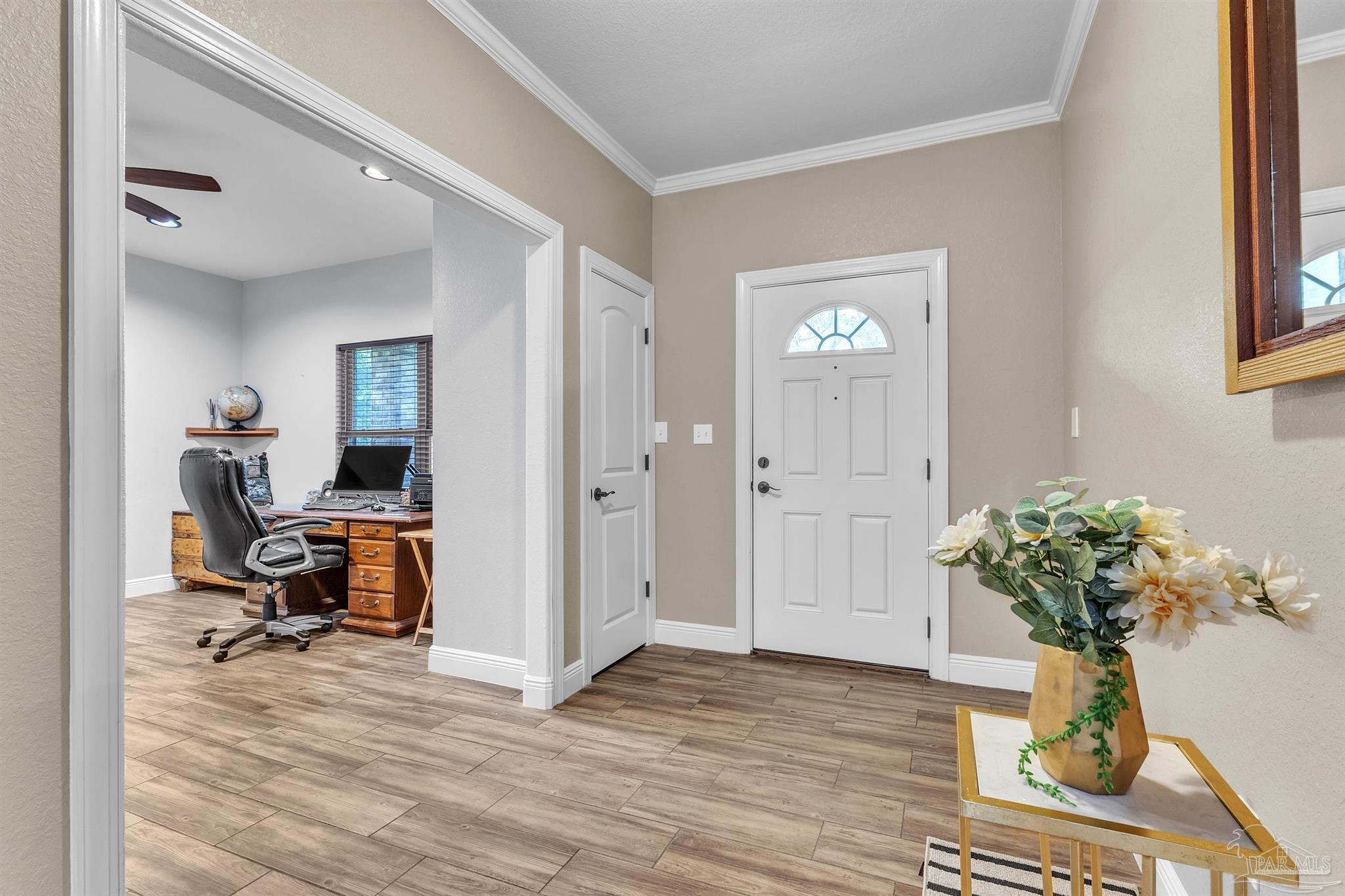 5406 Steele Road Baker, FL 32531 - Photo 4 of 46 a view of a workspace with furniture and a potted plant